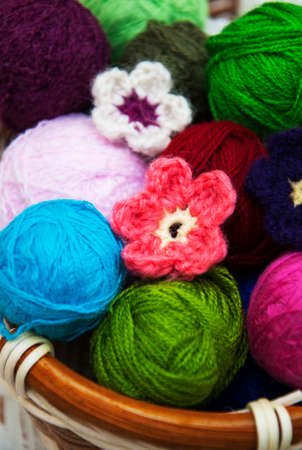 color woolen clews for knitting in a basketの写真素材