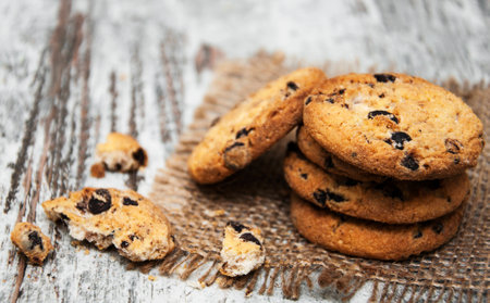 Chocolate cookies on a sacking napkin  on wooden table