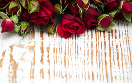 Fresh Red roses on a wooden backgroundの写真素材
