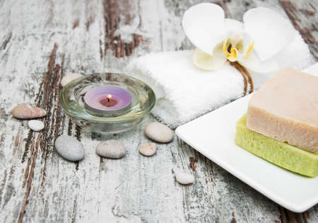 spa still life - a flowers  and towels  on a wooden backgroundの写真素材