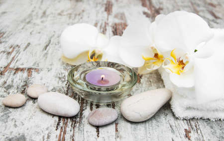 spa still life - a flower and towels on a wooden backgroundの写真素材