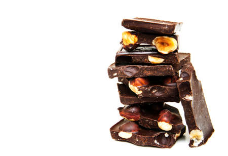 Dark  chocolate with nuts on a white backgroundの写真素材