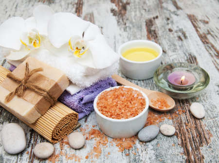 spa still life - a flowers  and towels  on a wooden backgroundの写真素材