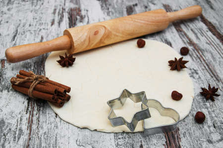 baking background - dough, cookie cutters and spices