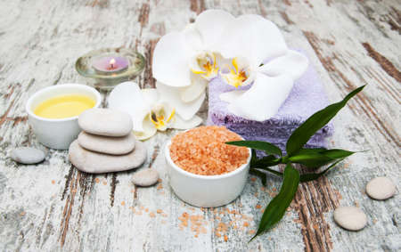 spa still life - a flowers  and towels  on a wooden backgroundの写真素材