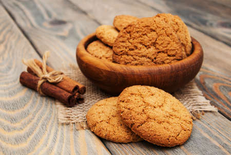 Oatmeal cookies on a old wooden backgroundの写真素材