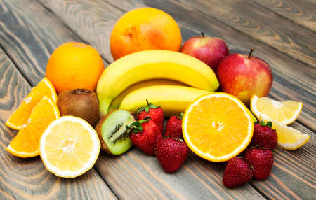 Assortment of fruits on a old wooden backgroundの写真素材