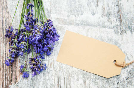 Lavender with tag on a old wooden backgroundの写真素材