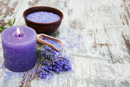 Lavender, sea salt and candle on a wooden backgroundの写真素材
