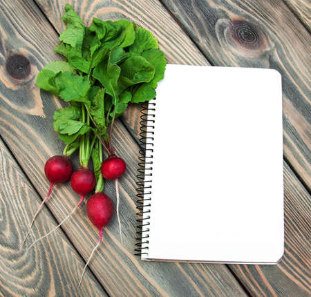 Fresh organic radish on a old wooden backgroundの写真素材