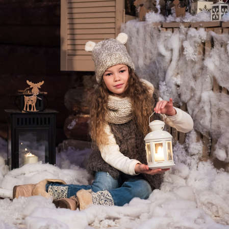 pretty little girl with flashlight at christmas timeの写真素材