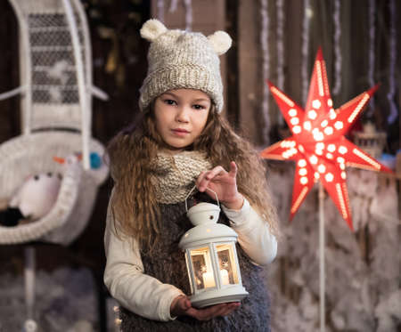 pretty little girl with flashlight at christmas timeの写真素材