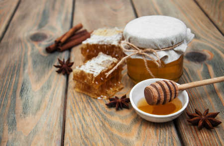 honey and spices on a old wooden backgroundの写真素材