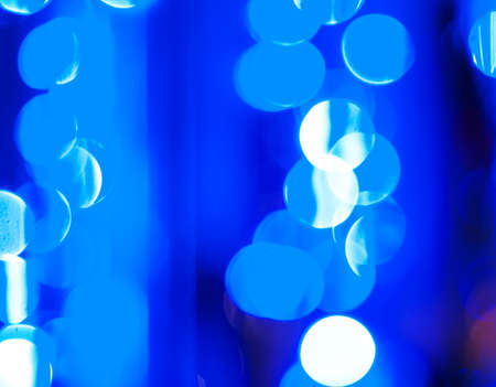 blue festive  abstract background with bokeh lights