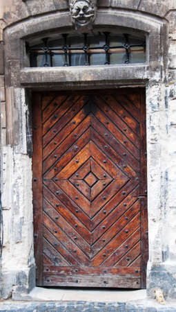 old brown wooden door in lvov - ukraineの写真素材