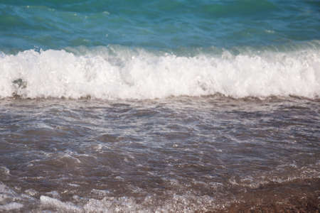 sea pebble on beach and sea water - nature background
