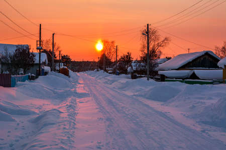 Winter landscape. Winter sunset in snowy villageの写真素材