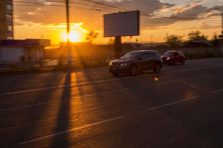 Photography from a moving car at slow shutter speeds. Blurred background.の写真素材