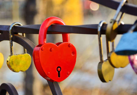 Red padlock in the shape of heart. The closed red padlock.Love padlockの写真素材
