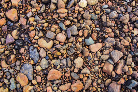 Pebbles on beach. Pebbles background. Natural colorful pebbles backgroundの写真素材