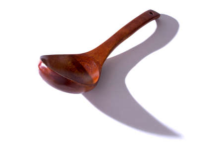 Wooden brown spoon on a white background it is isolatedの写真素材