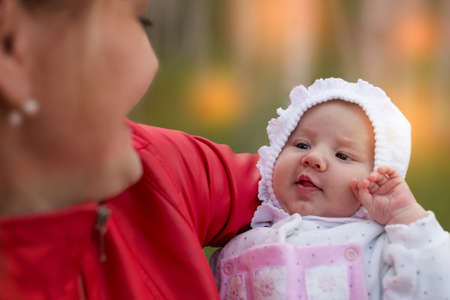 Small baby on mothers hands. Motherhood. Maternity. Top view. Mother holding her cute baby