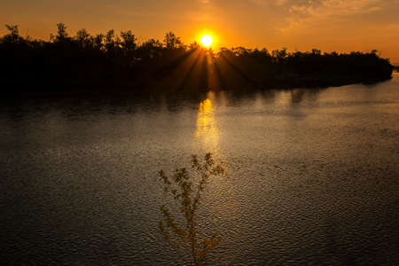 Beautiful sunset (or dawn) landscape with river.の写真素材