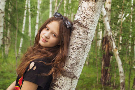 portrait of young woman in forestの写真素材
