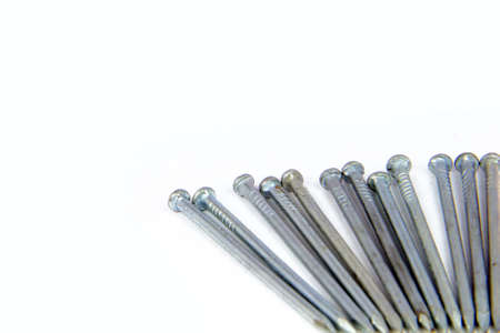 Metal nails on white backgroundの写真素材
