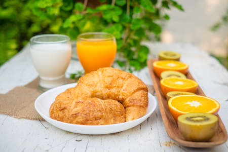 fresh bread fresh fruit orange juice and milkの写真素材