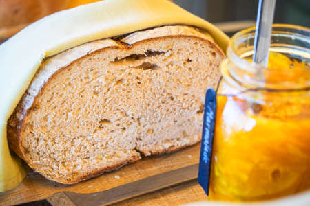 fresh bread cutting with jam