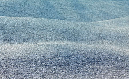 Snow barkhans. The texture of snow in the subject is backlit.の写真素材