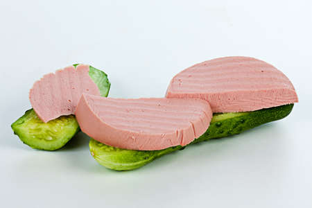 The funniest sandwich with sausage and cucumber on tableの写真素材