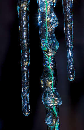 Thawing icicles drippingの写真素材