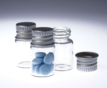 Medicine in bottle on white background