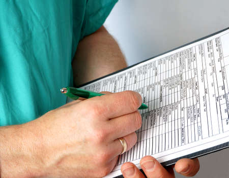 Doctor with medical chart の写真素材