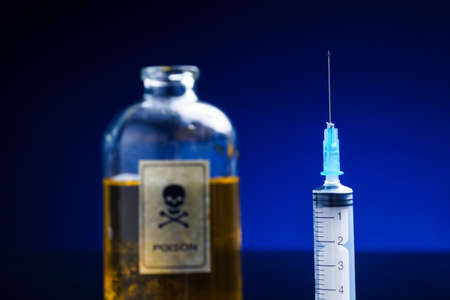 Open Vintage, retro poison bottle and syringeの写真素材