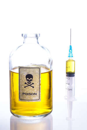 Poison bottle and syringe, and isolated on whiteの写真素材