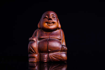 Statue of the Buddah isolated on blackの写真素材