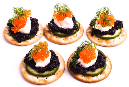 Caviar Appetizer served on crackers isolated on whiteの写真素材