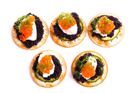 Caviar Appetizer served on crackers isolated on whiteの写真素材