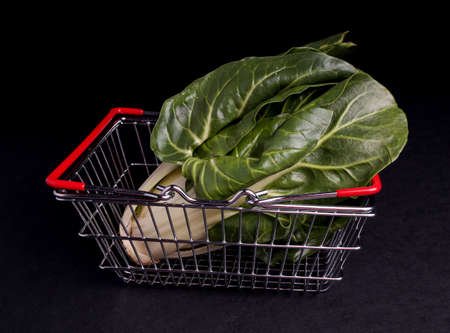 Shopping bag with Mangold isolated on Blackの写真素材