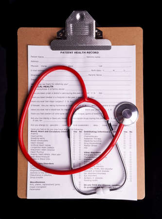 Medical Chart and stethoscope isolated on black background