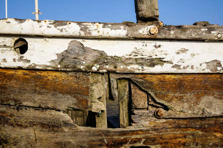 Close up view of the damage in an old wooden logs shipwrecksの写真素材