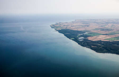 Aerial view of Coastal Town, with coastline and Clear waterの写真素材