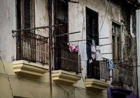 Slum facade with laundry hanging on the balconiesの写真素材