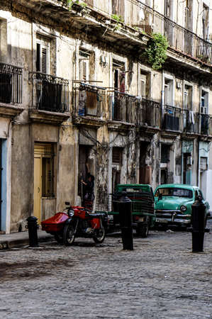 Havana, Cuba - January 5, 2016: Typical scene of one of streets in the center of La Havana - colonial architecture, carsのeditorial素材