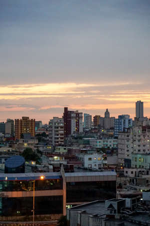 Havana, Cuba - January 8, 2016: Typical scene of the Capital La Havana - Sunset over the capital Havana, Cuba overlooking the buildings, street life and the Maleconのeditorial素材