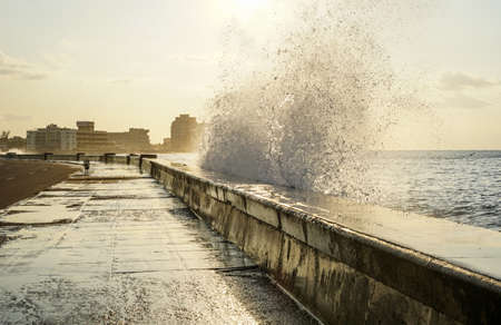 water splashing over the pier in havana, Cubaの写真素材