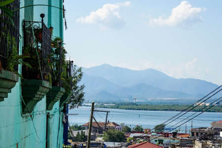 house wall with balconies and city views to the crystal clear blue waterの写真素材